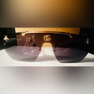 Gucci Men’s Shield Sunglasses in Dark Gradient Black with Gold Accents